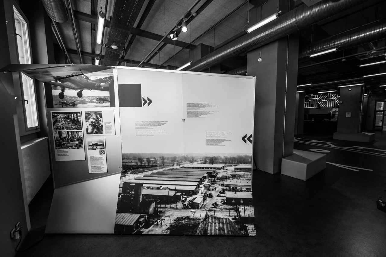 A photo of a display inside the Tempelhof Visitor Center depicting an aerial view of the forced-labor camp that was onsite during WWII